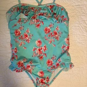 Cute teal floral suit, delicate ruffles. Liner on